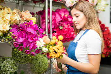 Woman choosing flowers for a bouquet
