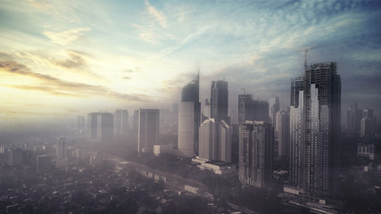 Fototapeta na wymiar Jakarta city on misty morning