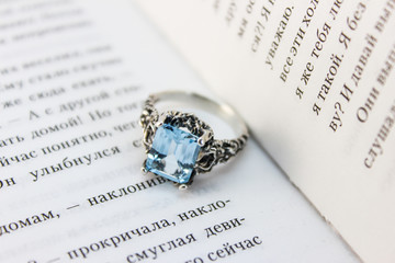 Silver ring with blue topaz