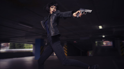 Fototapeta na wymiar Beautiful brunette sexy spy agent (killer or police) woman in leather jacket and jeans with a gun in her hand running after someone, to catch him on parking