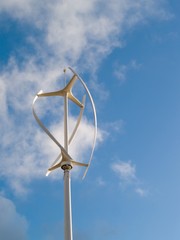 Vertical axis wind turbine revolving in a brisk wind with motion blur