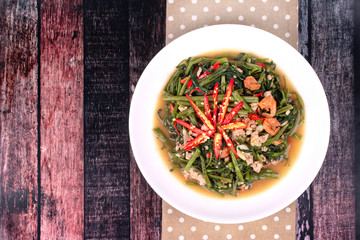 Fried spicy Chinese morning glory with minced pork and dried shrimps .