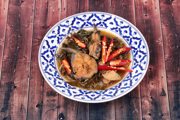 Spicy sliced catfish curry in coconut milk with Morinda citrifolia leaf .