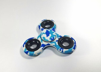 Fidget spinner with camouflage pattern