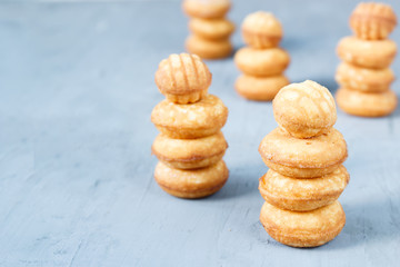 Biscuit cookies in the form of a tower. Selective focus. Copy space.