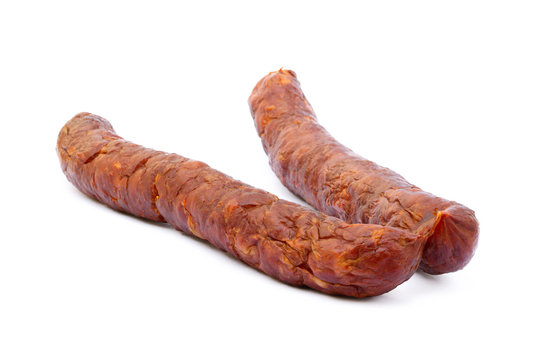 Tasty high quality smoked sausage isolated on white background