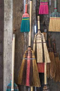 Colorful broom on the wodden w