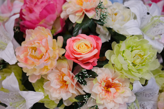 Closeup to artificial flowers background