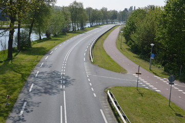Fototapeta na wymiar Empty Road And Bycicle Path