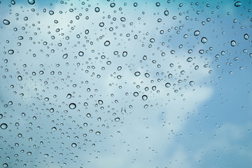 water droplets on blue glass 