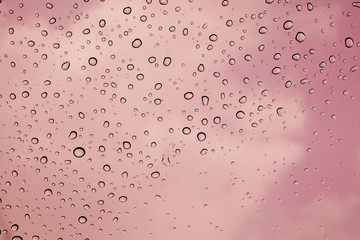 water droplets on pink glass 