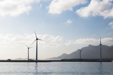 turbines at wind farm on sea shore