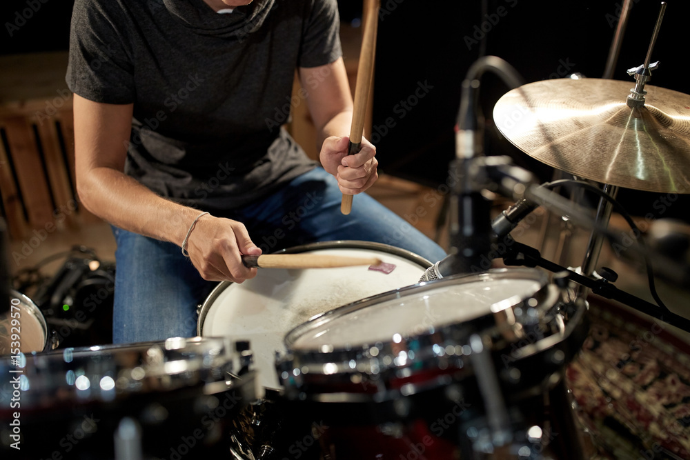 Wall mural male musician playing drums and cymbals at concert