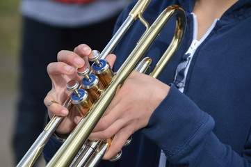 Fototapeta na wymiar Boy Playing Trompet