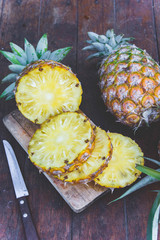 pineapple fruit on wood table