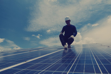 engineer and electrician team swapping and install solar panel ; electrician team checking hotspot on break panel