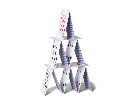 house of playing cards over white background