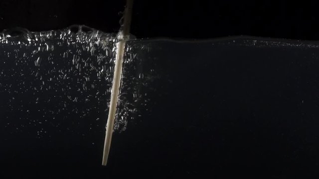 Closeup of mixing water on the black background
