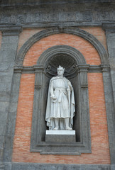 Fototapeta na wymiar Statue of Carlo I d'Angio on the facade of Royal Palace in Naples