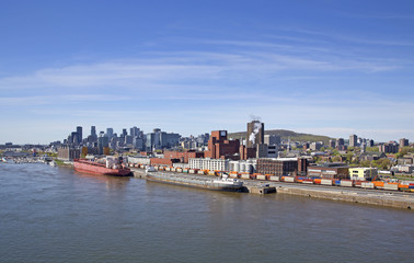 Naklejka premium View of Montreal city with reflection on the water, day