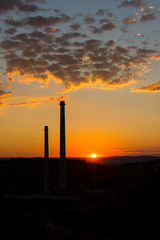 Sunset above the chimney, chemical industry