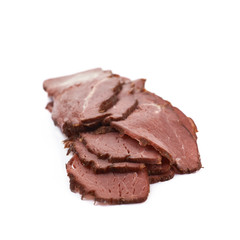Pile of ham meat slices isolated