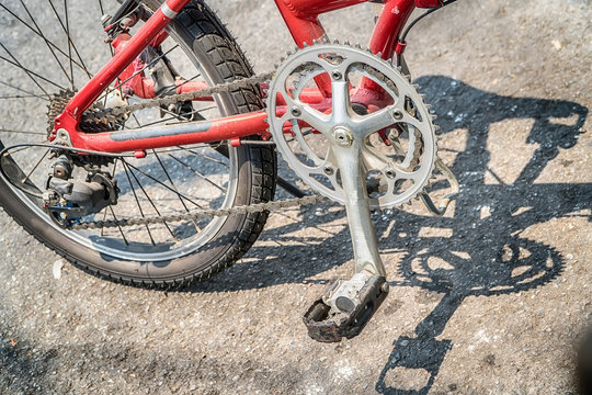 Closer shot of man's feet based on bicycle's pedal