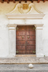 Fototapeta premium Historic, colonial entrance door with knocker in Cartagena, Colombia
