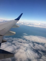 Fototapeta na wymiar Airplane Travel looking Out Window