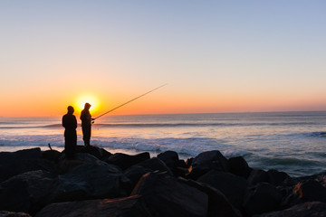 Fishermen Silhouetted Ocean Beach Horizon Sunrise