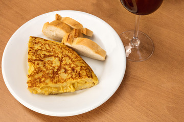 Spanish tortilla with wine, tapas in a bar