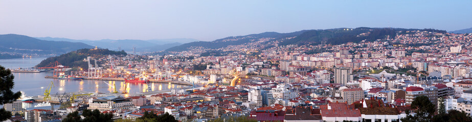 panoramic view of Vigo city in Spain at sunset with illumination - obrazy, fototapety, plakaty