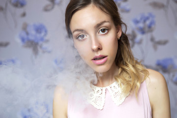 Beautiful brunette bride woman with curly hairstyle and neutral nude make up. Clear fresh young face skincare. Sensual look. Neutral violet background with flowers on it