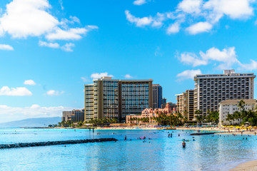 Waikiki Beach, with its many resorts under blue sky and white sand, makes it one of the world's most famous beaches. Located in Honolulu on the Hawaiian island of Oahu 