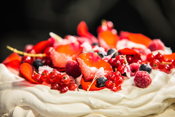 Cake Pavlova with cream and fresh fruits.