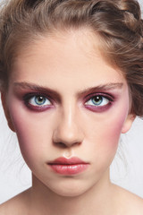 Fototapeta na wymiar Close-up portrait of young beautiful girl with stylish make-up