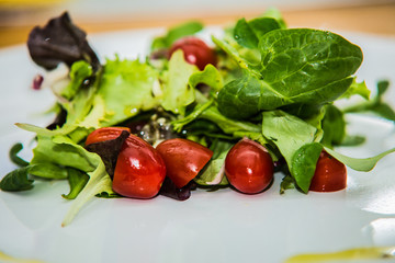 Salad with fresh vegetables on the plate.