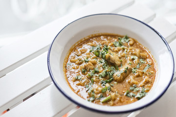 creamy spicy seafood fish soup with coriander