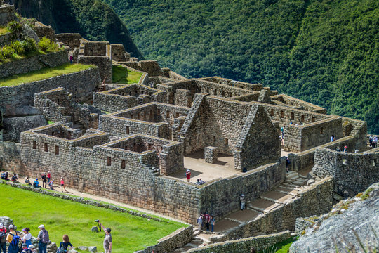 MACHU PICCHU, PERU - MAY 18, 2015: Crowds of visitors at Machu Picchu ruins, Peru.