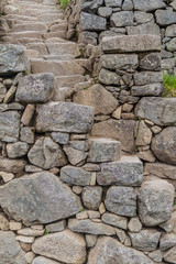 Narrow steep stairs at Machu Picchu ruins, Peru