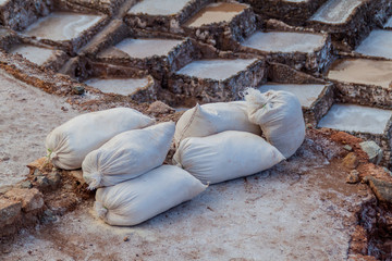 Bags of salt at salt extraction pans (Salinas) in Sacred Valley of Incas, Peru
