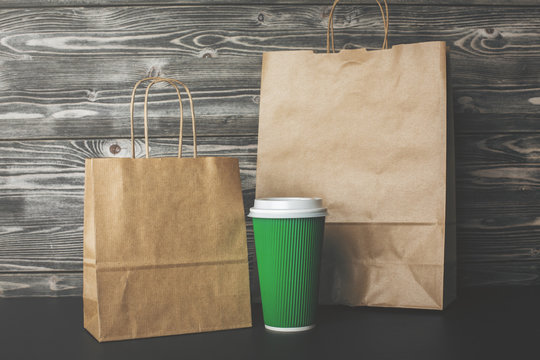 Blank shopping bags and coffee closeup