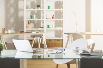 Glass desktop with laptop