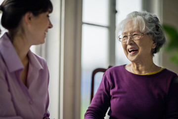Elderly woman speaking with her doctor.