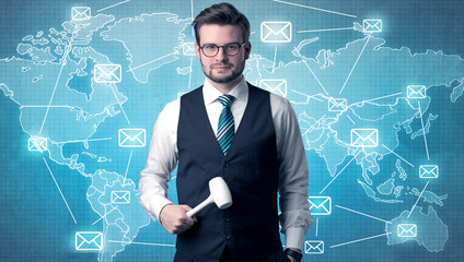 Handsome businassman standing with tool on his hand