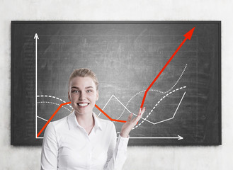 Enthusiastic blond woman shows growing graph