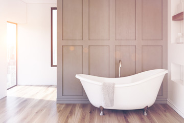Fototapeta na wymiar Gray bathroom, white tub, toned