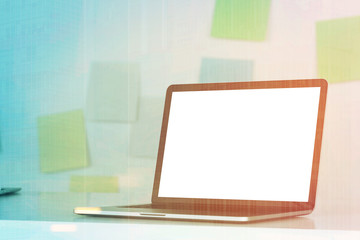 Fototapeta premium Laptop on desk, sticky notes, toned