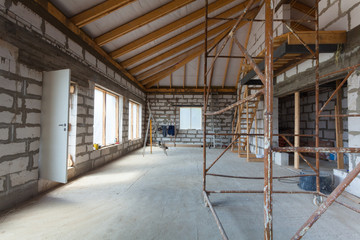 Interior of apartment with ladders during under renovation, remodeling and construction (preparing...
