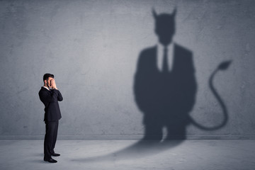 Fototapeta premium Businessman standing in front of a wall